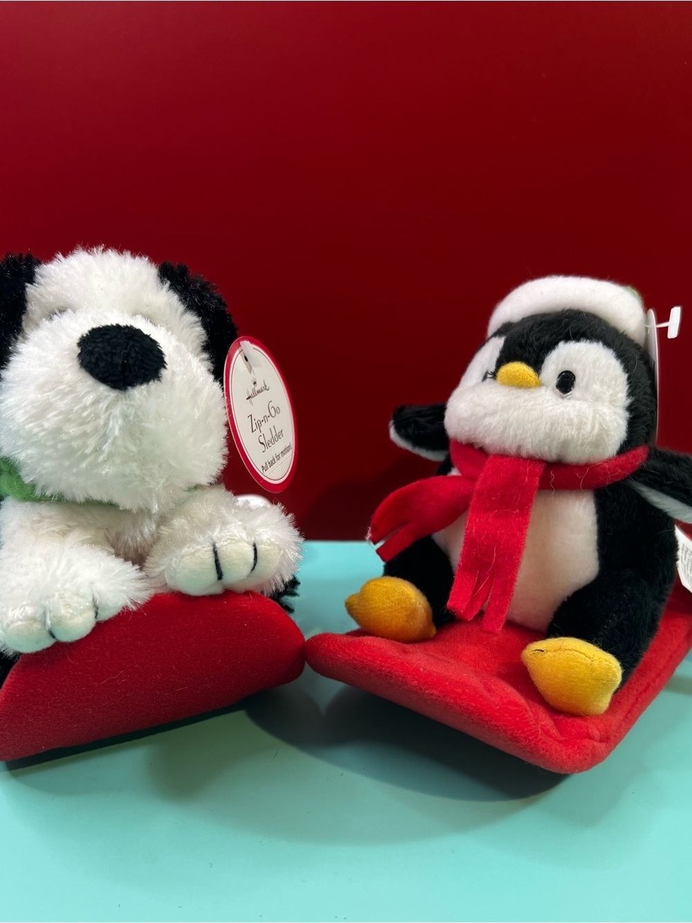 Hallmark Black & White Penguin with Red Scarf Plush Sledder